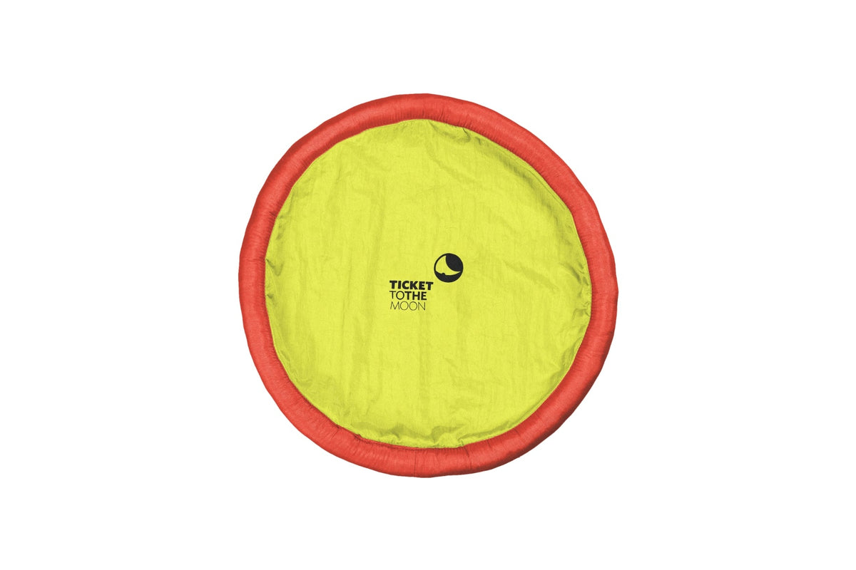 Moon Disc (Pocket) in lime green with a red rim, laid flat, top view