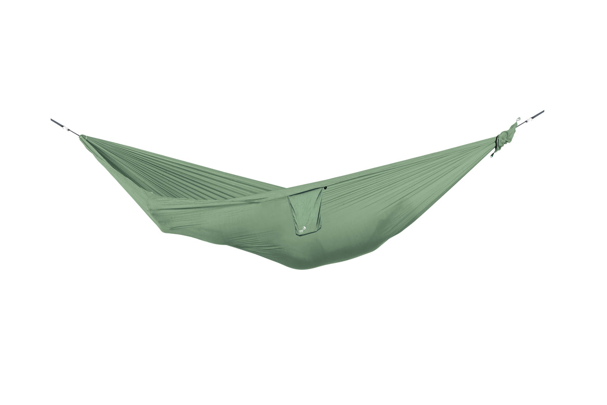Travel Hammock Compact in sage green, hung empty, side view