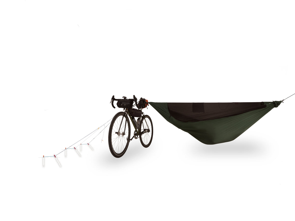 Hammock with a bicycle attached to it on a white background