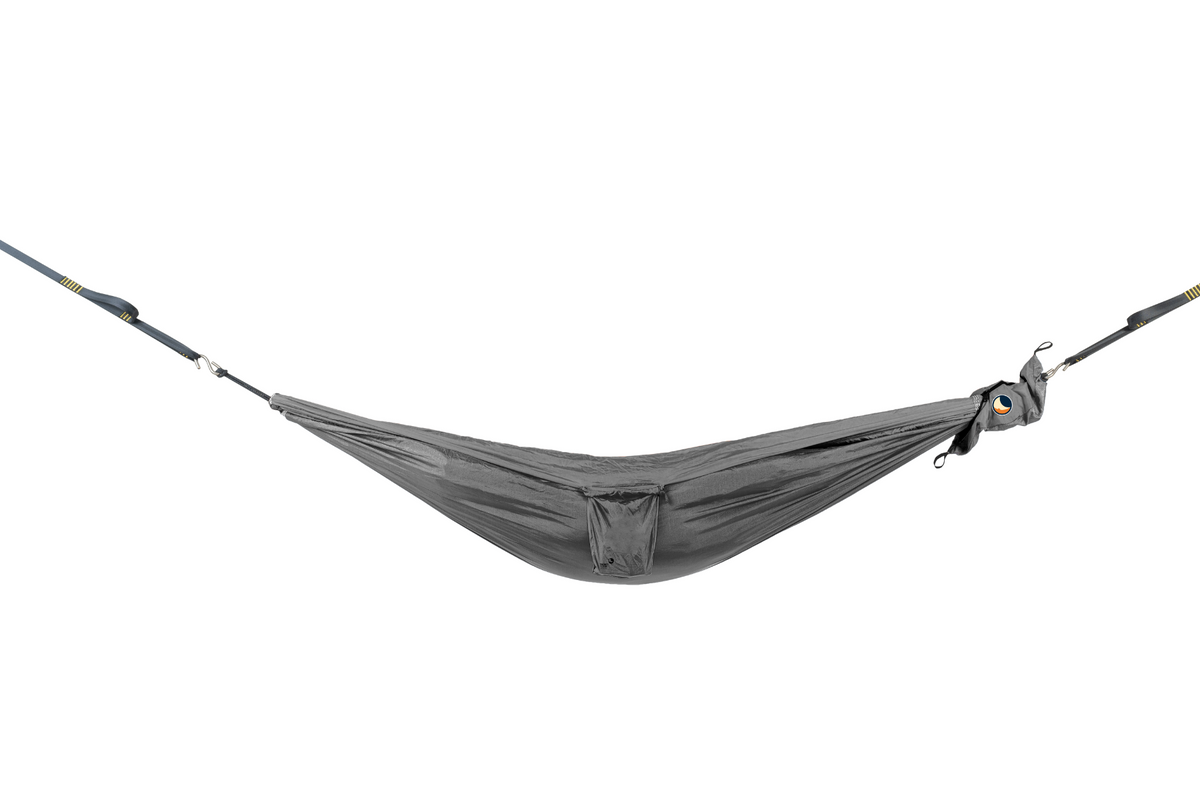 Travel Hammock Mini in Dark Grey hung empty from tree straps, small pocket in the middle