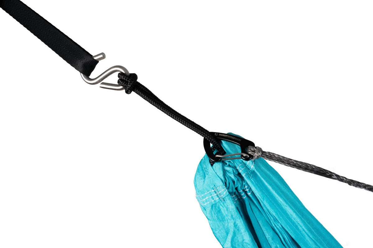Close-up of the Ridgeline attached at a turquoise hammock end, beside the black suspension cord and strap hook
