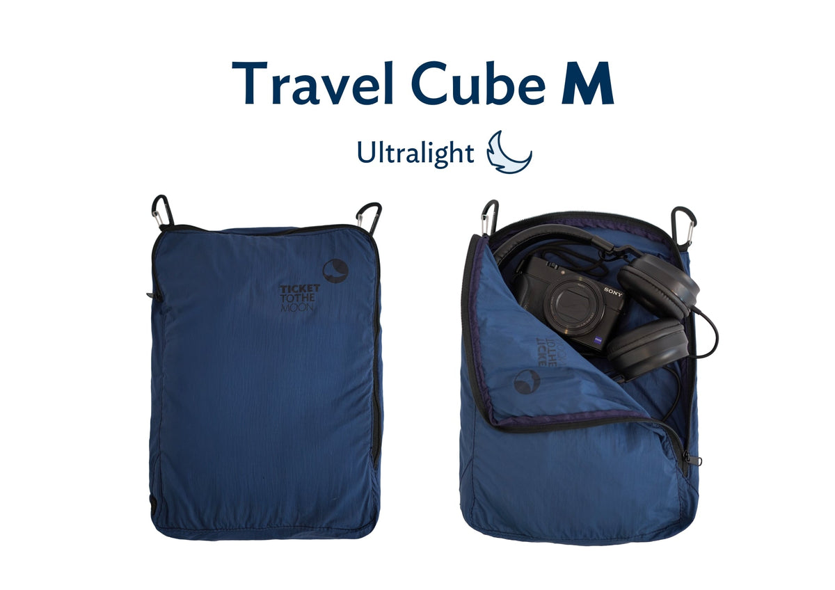 Travel Cube Medium, Ultralight version in navy blue, shown closed and open with a camera and headphones inside