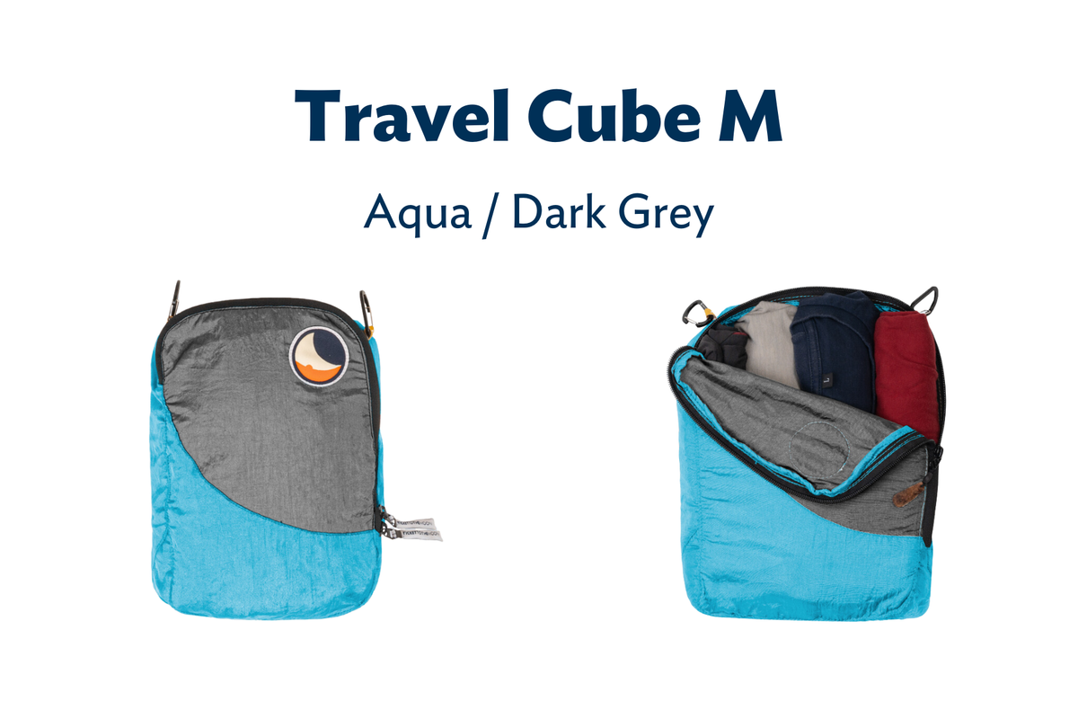 Travel Cube Medium (Custom) in Aqua and Dark Grey, shown closed and unzipped with rolled clothes inside
