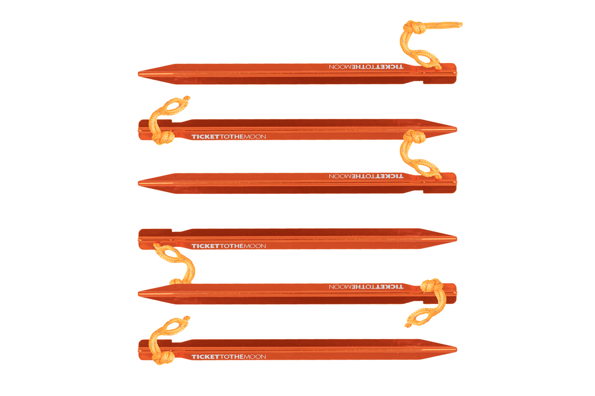 Pegs Set (6-Pack): six orange aluminium pegs with orange cord loops and Ticket To The Moon branding
