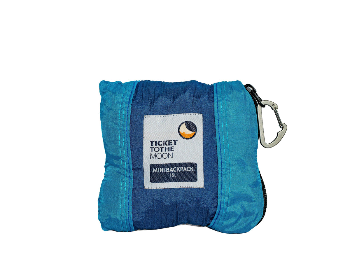 Mini Backpack 15L folded into its blue pouch with a carabiner