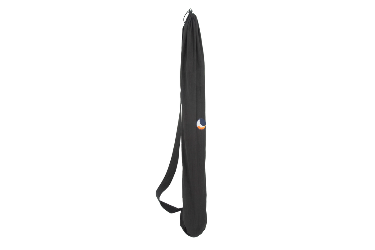 Moon Chair packed in its black carry bag with a shoulder strap