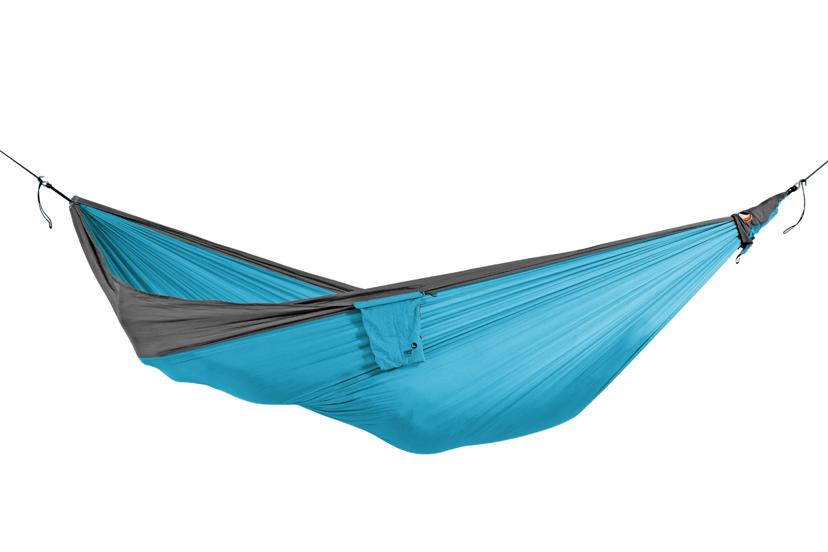 Travel Hammock Original in Aqua and Dark Grey, hung empty with its stuff sack attached, side view
