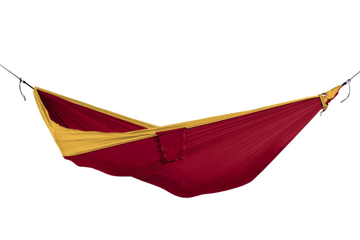 Travel Hammock Original in Burgundy and Dark Yellow, hung empty with its stuff sack attached, side view
