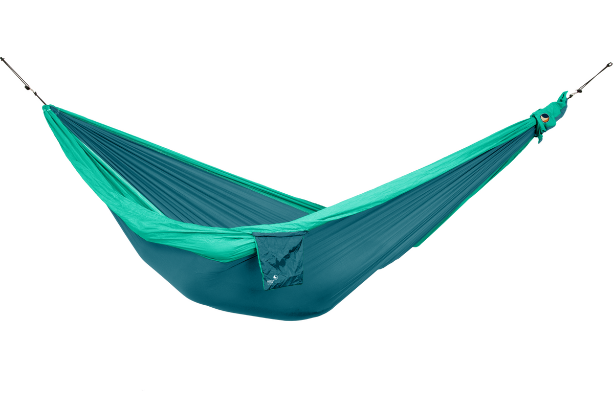 Travel Hammock Original in Emerald Green and Green, hung empty with its stuff sack attached, side view
