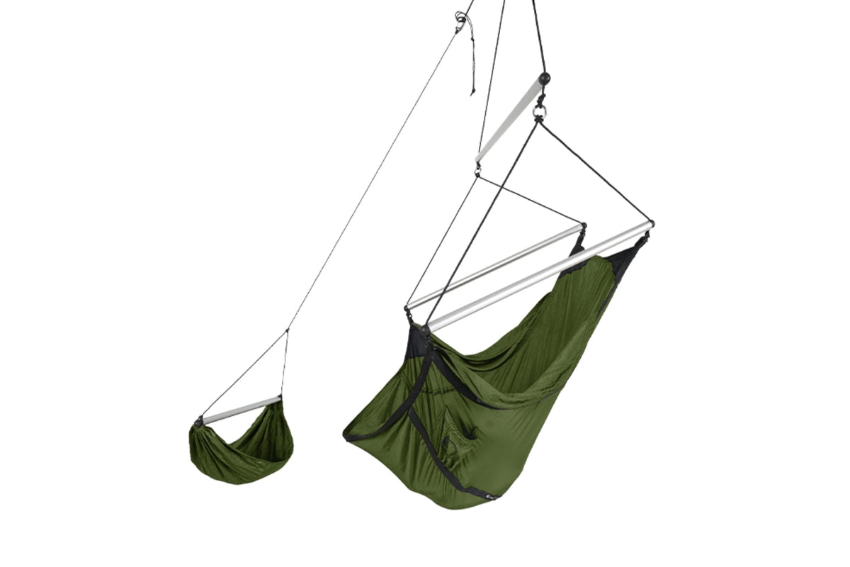 Moon Chair in olive green with aluminium spreader bars and matching footrest, hanging from a single point
