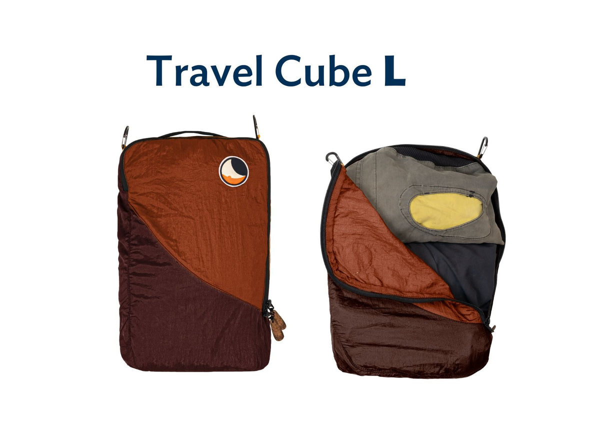 Travel Cube Large in burgundy and rust orange, shown closed and open with a jacket packed inside