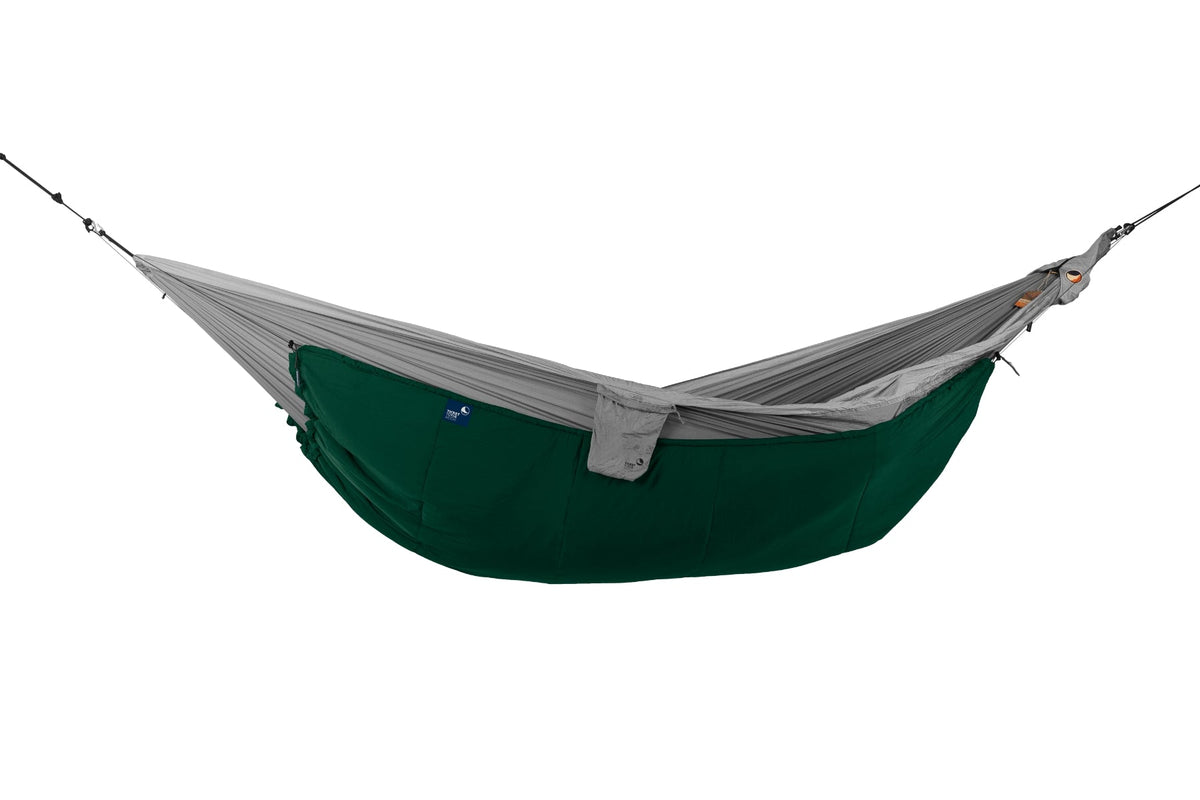 Moonquilt Compact in green fitted beneath a grey hammock, hung empty, side view